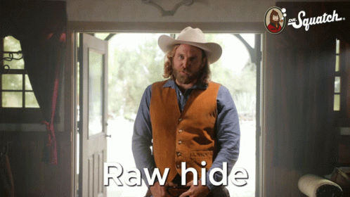 A Man In A Cowboy Hat Stands In Front Of A Door With The Words Raw Hide Written On The Bottom GIF