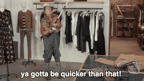 A Man In A Cowboy Outfit Is Saying Ya Gotta Be Quicker Than That In A Clothing Store GIF