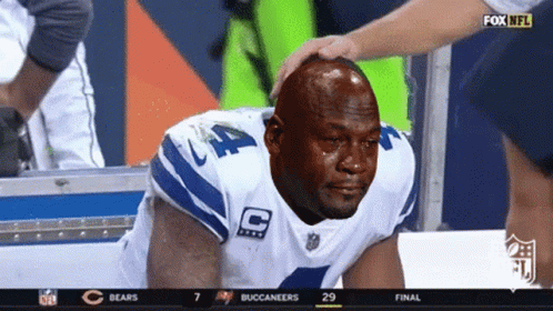 A Man In A Cowboys Jersey Is Crying During A Game GIF