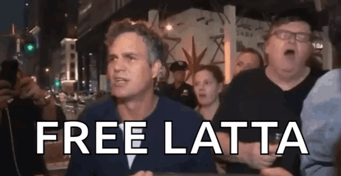 A Man In A Crowd Says Free Latta In Front Of A Police Officer . GIF