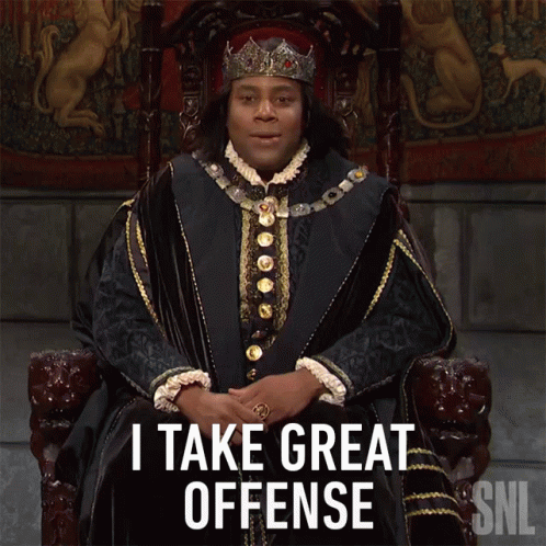 A Man In A Crown Is Sitting In A Chair And Says I Take Great Offense GIF