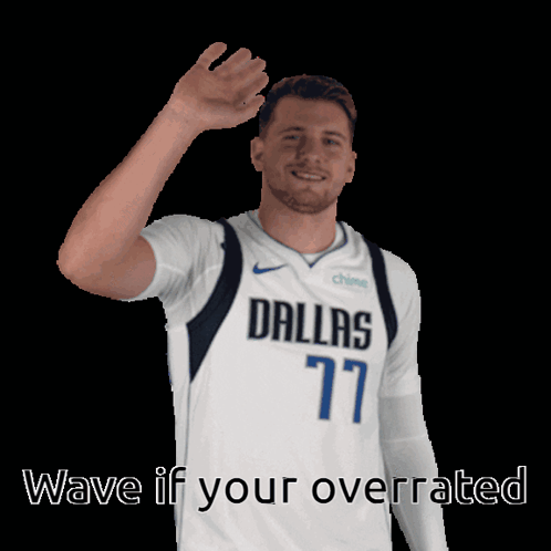 A Man In A Dallas 77 Jersey Is Waving His Hand GIF