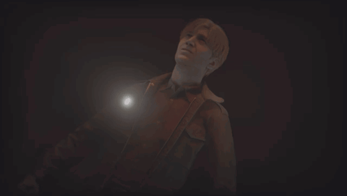 A Man In A Dark Room With A Flashlight GIF