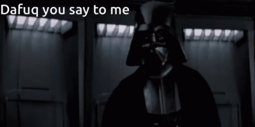 A Man In A Dark Room With The Words " Dafug You Say To Me " On The Bottom GIF