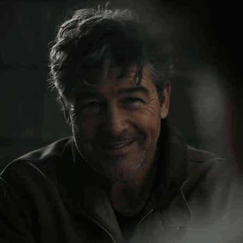 A Man In A Dark Room With The Words Green Lantern On The Bottom GIF