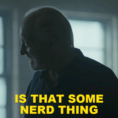 A Man In A Dark Room With The Words " Is That Some Nerd Thing " Above Him GIF