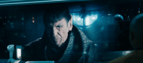 A Man In A Dark Room With The Words That Being Said Above Him GIF