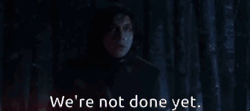 A Man In A Dark Room With The Words We 'Re Not Done Yet . GIF