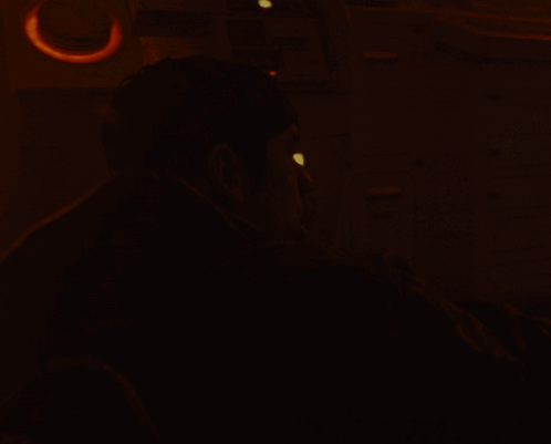 A Man In A Dark Room With The Words " Yo Hop On League " On The Bottom GIF
