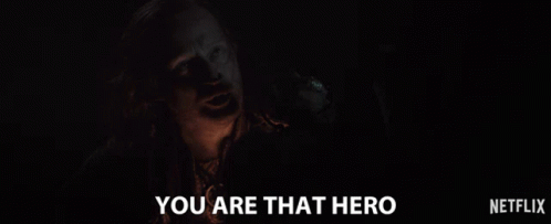A Man In A Dark Room With The Words You Are That Hero Below Him GIF