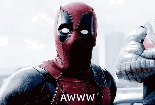 A Man In A Deadpool Costume Is Giving A Thumbs Up And Says Awww . GIF