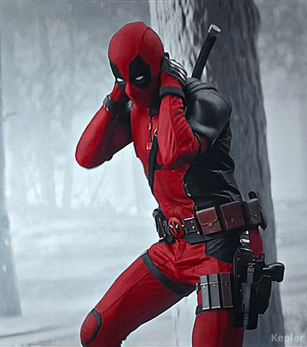 A Man In A Deadpool Costume Standing Next To A Tree With Kepler Written On The Bottom GIF