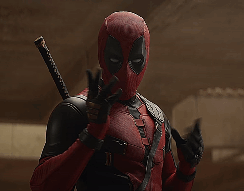 A Man In A Deadpool Costume With A Sword Behind His Back GIF
