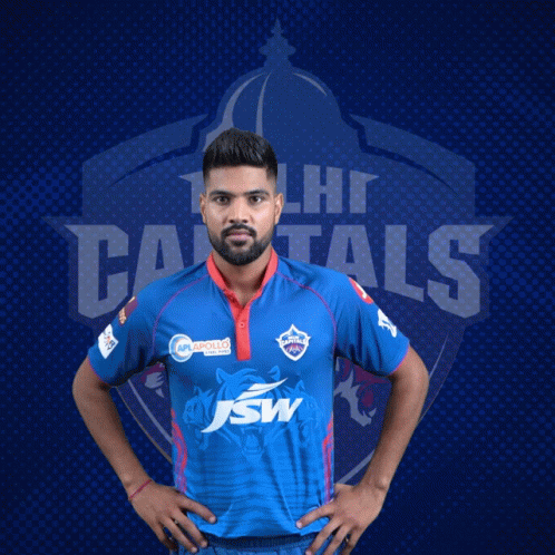 A Man In A Delhi Capitals Jersey Poses For A Photo GIF