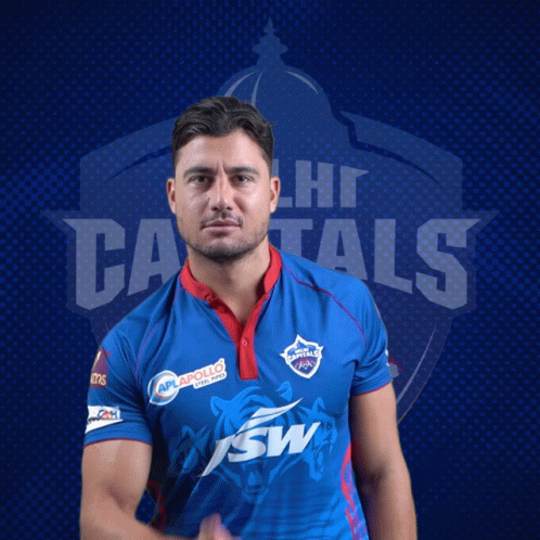 A Man In A Delhi Capitals Jersey Poses For A Picture GIF