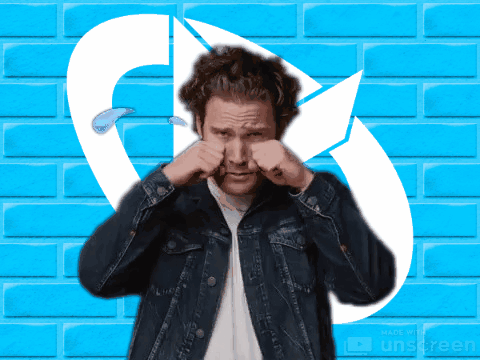 a man in a denim jacket is rubbing his nose in front of a blue brick wall made by unscreen