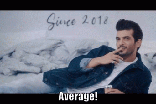 Man In Denim Jacket Sitting Smoking Whiskey GIF