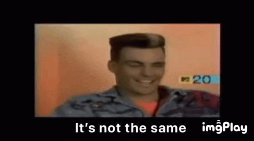 A Man In A Denim Jacket Is Smiling In A Video . GIF
