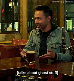 A Man In A Denim Jacket Sits At A Bar With A Mug Of Beer And Talks About Ghost Stuff GIF