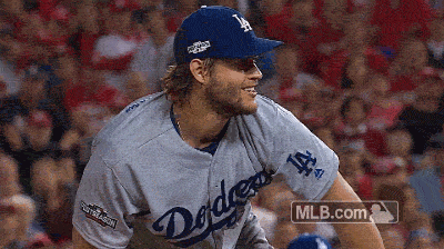 A Man In A Dodgers Jersey Is Smiling GIF