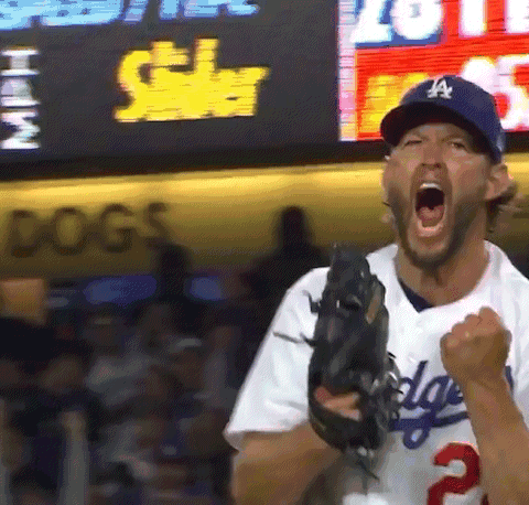 A Man In A Dodgers Uniform Is Holding A Baseball Glove GIF