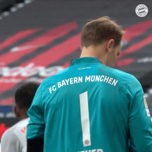 a man in a fc bayern munchen jersey