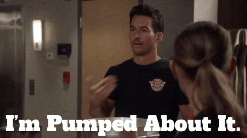 a man in a fireman 's shirt says i 'm pumped about it while talking to a woman