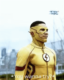 A Man In A Flash Costume Is Standing In Front Of A City Skyline And Says " You Wanna Try " GIF