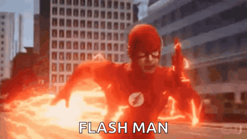 A Man In A Flash Suit Is Running Through A City While Holding A Gun . GIF