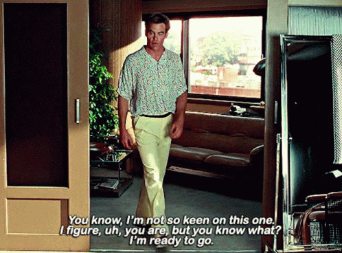 A Man In A Floral Shirt Is Talking To Another Man GIF