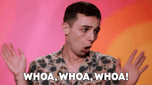 A Man In A Floral Shirt Says Whoa Whoa Whoa With His Hands Outstretched GIF