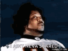 A Man In A Football Uniform Is Looking Up And Saying I Ain T Neva Scared . GIF