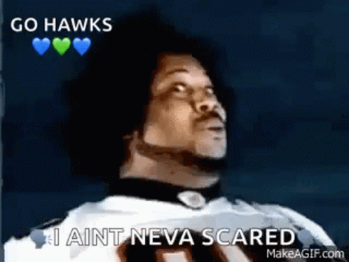 A Man In A Football Uniform Is Saying `` Go Hawks , I Ain T Neva Scared '' . GIF