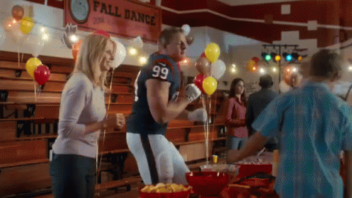 A Man In A Football Uniform With The Number 99 On His Jersey GIF