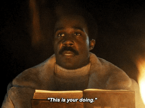 a man in a fur coat is holding a book and says " this is your doing "