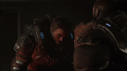 A Man In A Futuristic Armor With A Light On His Chest GIF