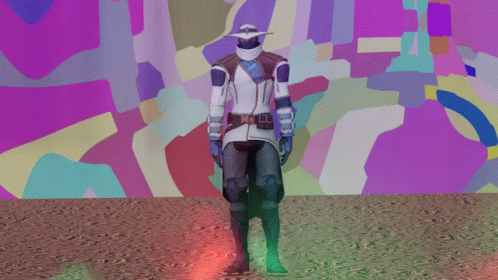 A Man In A Futuristic Outfit Stands In Front Of A Colorful Background GIF