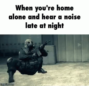 A Man In A Gas Mask Is Holding A Gun And The Caption Says When You 'Re Home Alone GIF