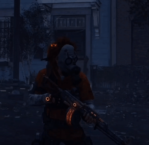 A Man In A Gas Mask Is Holding A Rifle With A Skull On His Head GIF