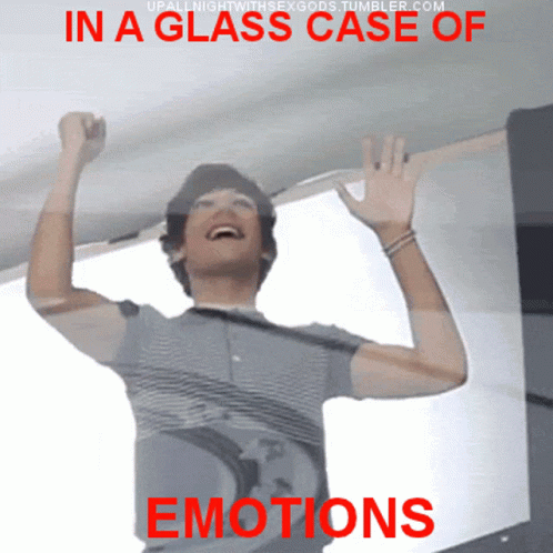 A Man In A Glass Case Of Emotions Laughs GIF