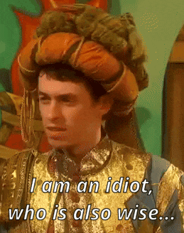 A Man In A Gold And Blue Costume Says I Am An Idiot Who Is Also Wise GIF