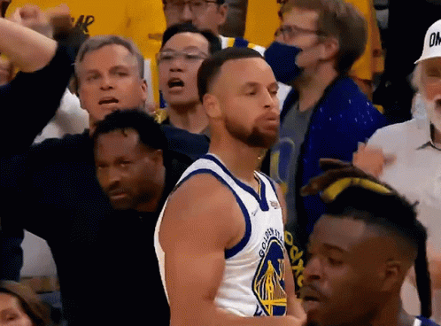 A Man In A Golden State Warriors Jersey Stands In The Crowd GIF
