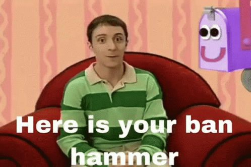 A Man In A Green And Green Striped Shirt Is Sitting In A Red Chair With A Purple Mailbox In The Background . GIF