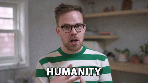A Man In A Green And White Striped Shirt With The Word Humanity On It GIF