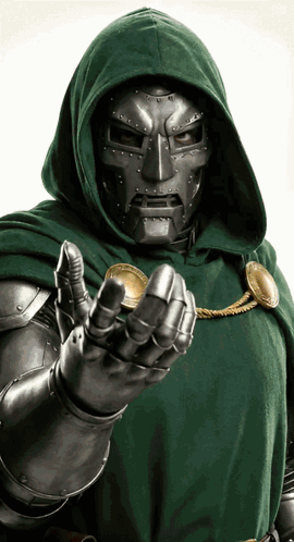 A Man In A Green Cape And Mask Holds A Coin GIF