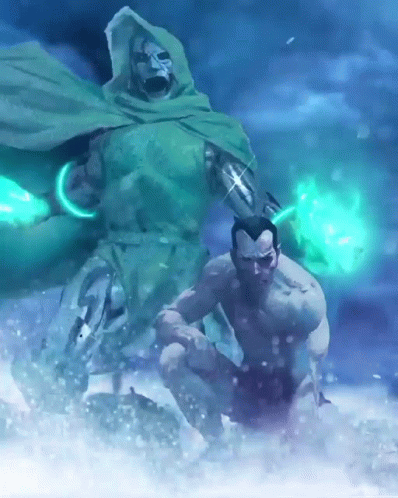 A Man In A Green Cape Is Kneeling Down Next To A Man In A Green Cape GIF