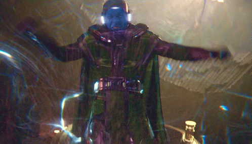 A Man In A Green Cape Is Standing In A Dark Room GIF
