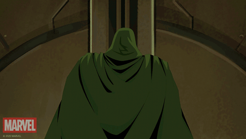 A Man In A Green Cape Is Standing In Front Of A Marvel Sign GIF