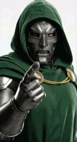 A Man In A Green Hooded Cloak Is Pointing His Finger GIF
