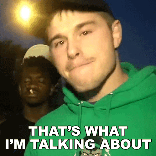 A Man In A Green Hoodie Is Talking About Something GIF